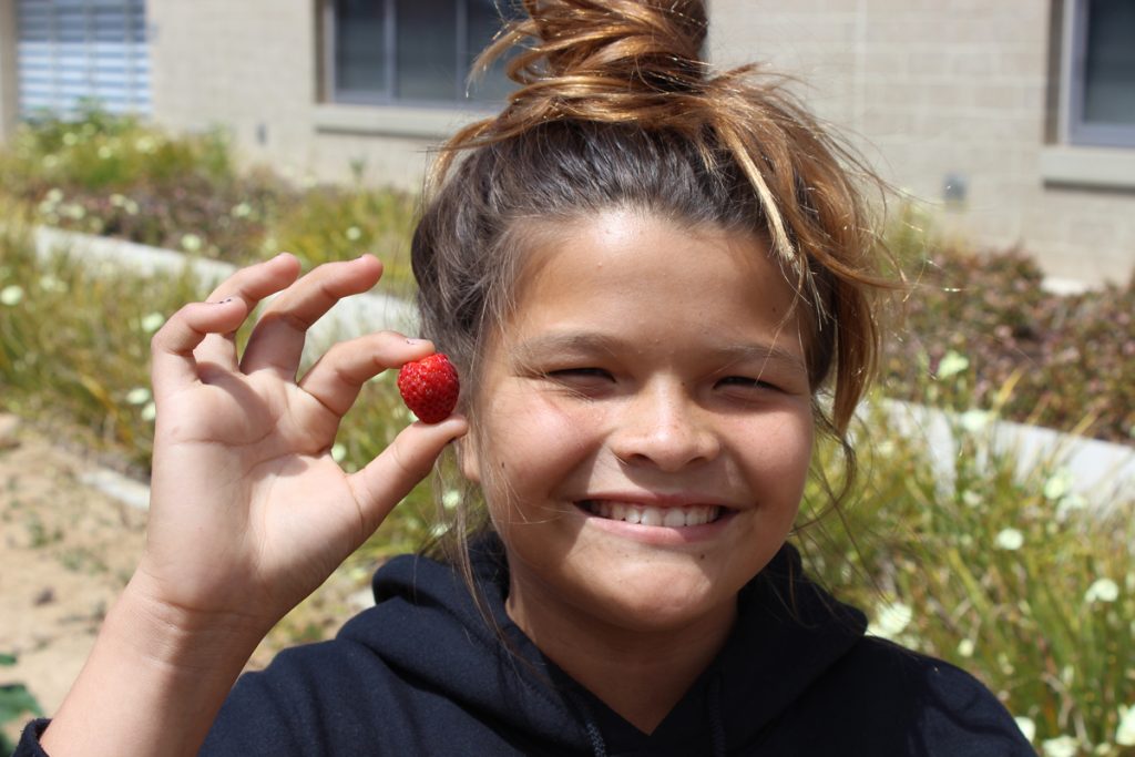 Student with a strawberry